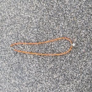 Orange snowflake necklace